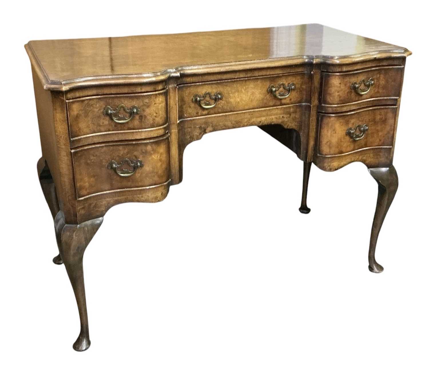 Lot 33 - A 1930s walnut desk, with single drawer...