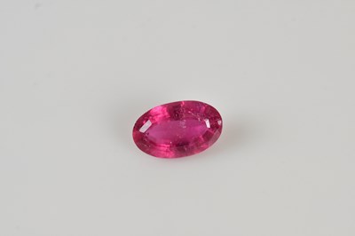 Lot 55 - LOOSE GEMSTONES; a oval cut pink tourmaline 12....