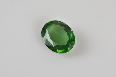 Lot 267 - LOOSE GEMSTONE; an oval cut gemstone, pale...