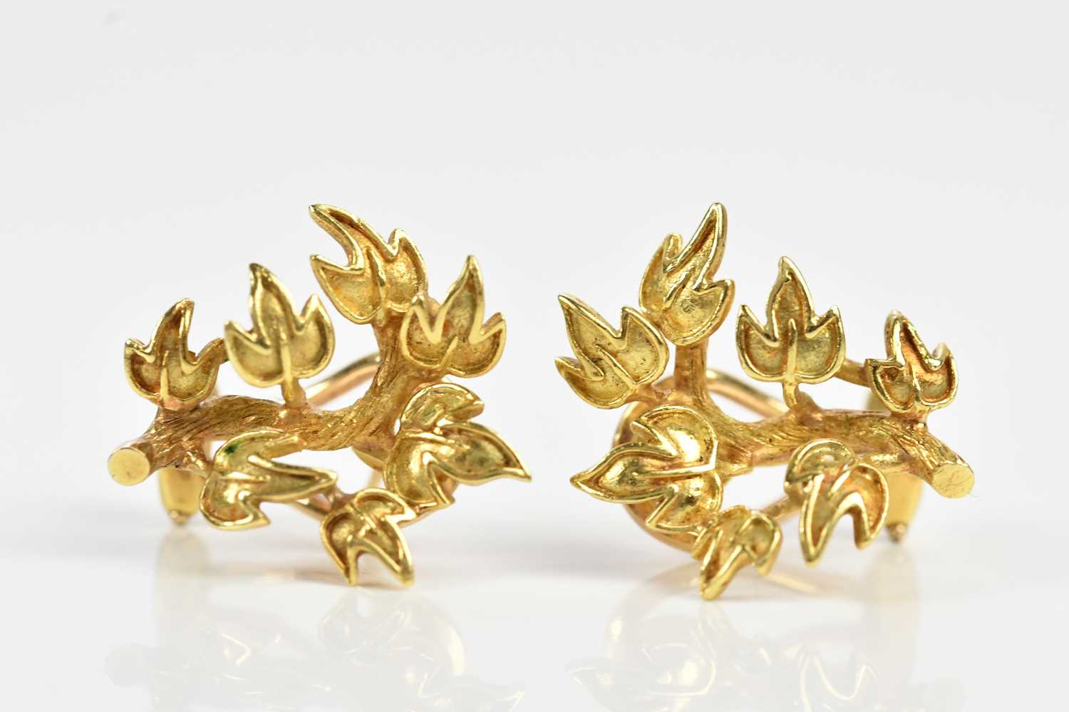 Lot 246 - A pair of textured yellow metal ear studs...