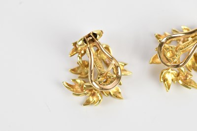 Lot 246 - A pair of textured yellow metal ear studs...
