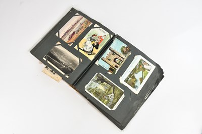 Lot 514 - An early 20th century postcard album...