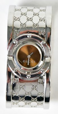 Lot 1135 - A silver-coloured 'Twirl' bangle wristwatch,...