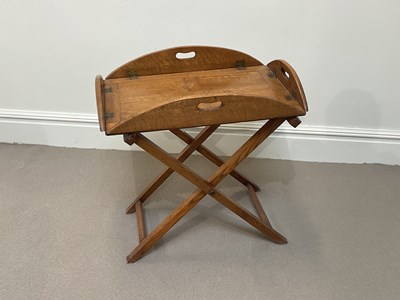 Lot 2010 - An Edwardian oak butler's tray on folding...