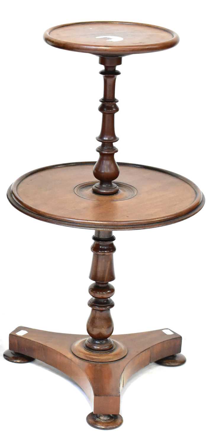 Lot 35 - A William IV walnut two-tier dumb waiter,...