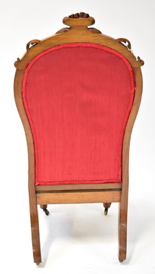 Lot 18 - A 19th century carved walnut framed spoon back...