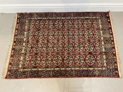 Lot 286 - A decorative Eastern rug with stylised motifs...