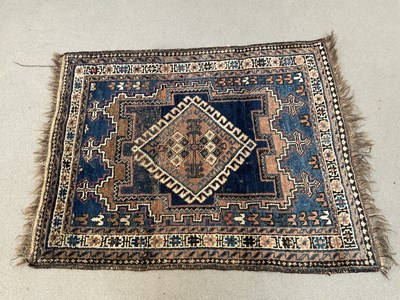 Lot 297 - An eastern prayer matt with stylised lozenge...
