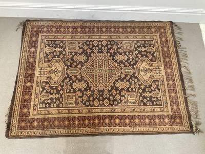 Lot 281 - An eastern rug, decorated with stylised detail...