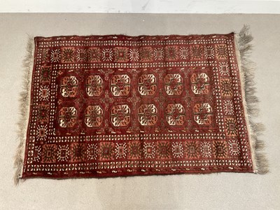 Lot 282 - A Bokara rug with elephant foot decoration on...