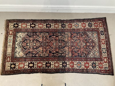 Lot 275 - A decorative eastern rug with stylised motifs...