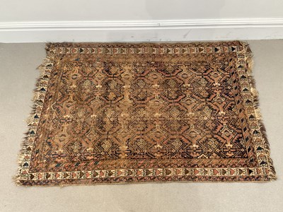 Lot 292 - A late 19th century Eastern rug with stylised...