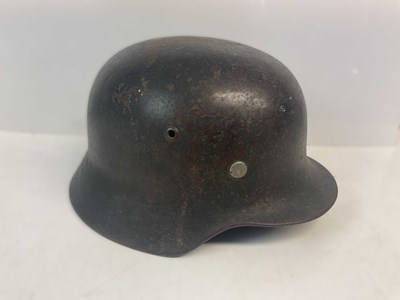 Lot 218 - A WWII M35 German helmet.