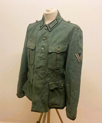 Lot 198 - A WWII German M40 Infantry combat tunic, with...