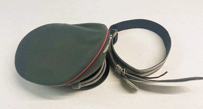 Lot 204 - A WWII German officer's peak cap with pink...