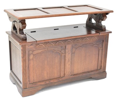 Lot 7 - A reproduction oak monk's bench, with box seat...