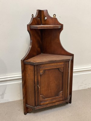 Lot 2072 - An early 20th century carved walnut hanging...