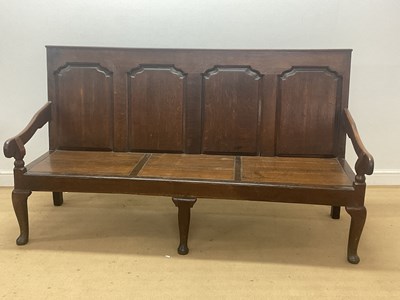 Lot 789 - A Georgian oak settle bench with four back...