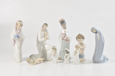 Lot 1222 - LLADRO; a collection of nine figures including...