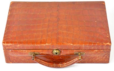 Lot 537 - ASPREY, LONDON; a crocodile skin suitcase form...