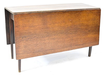 Lot 29 - A George III oak drop-leaf supper table, on...