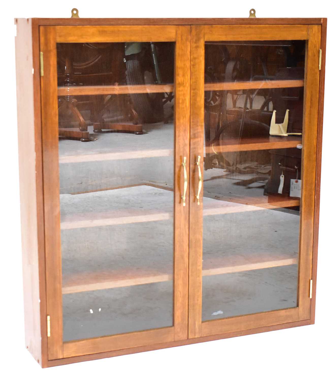 Lot 9 - A mahogany glazed wall-hanging cupboard of...
