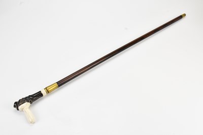 Lot 425 - An early 20th century carved horn and bone...