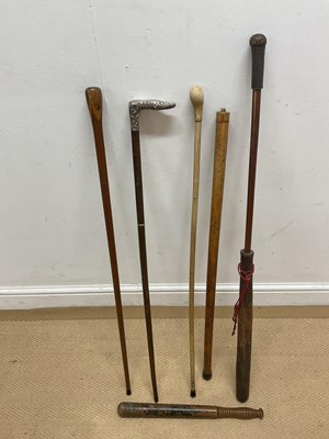 Lot 51 - Four walking sticks, one with white metal...