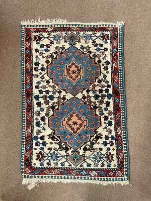 Lot 2170 - A hand knotted woollen Eastern style rug with...