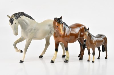 Lot 1243 - BESWICK; two figures of horses, with a further...