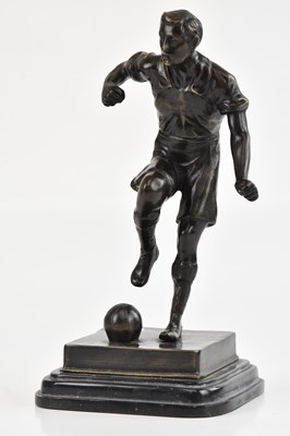 Lot 2316 - A bronze figure of a footballer, possibly...