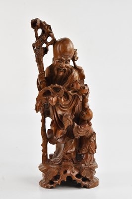 Lot 1069 - A Chinese root figure of Shou Lao, height 36cm.