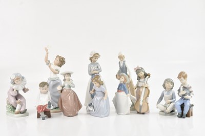 Lot 1267 - NAO; ten figures including young girl holding...