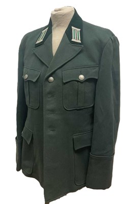 Lot 216 - A post war East German DDR green military...