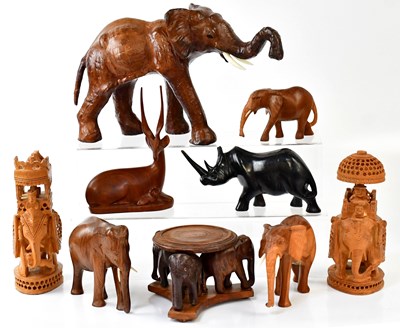 Lot 519a - Twenty-six carved wooden elephant figures in...