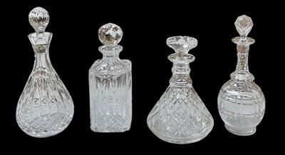 Lot 719 - Four assorted cut and crystal glass decanters,...