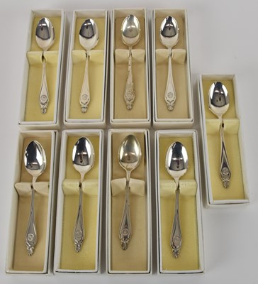 Lot 1139 - A set of ten white metal teaspoons, all...