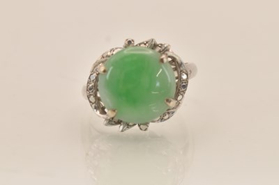 Lot 1275 - An 18K white gold marcasite and circular green...