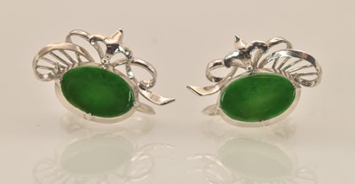 Lot 1445 - A pair of 14K white gold green jade set...