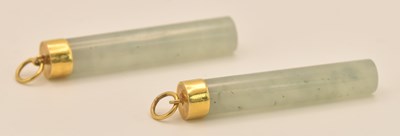 Lot 1426 - A pair of Chinese yellow metal green jade rod...