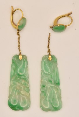 Lot 1443 - A pair of Chinese yellow metal carved green...