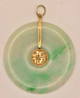 Lot 1413 - A Chinese yellow metal carved green jade bi...