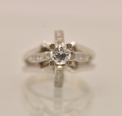 Lot 1247 - A white metal diamond solitaire ring, the...