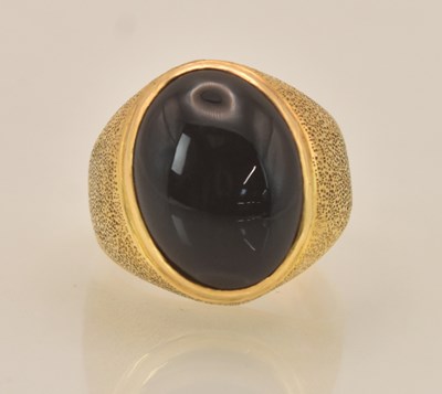 Lot 1256 - A Chinese yellow metal signet ring with oval...