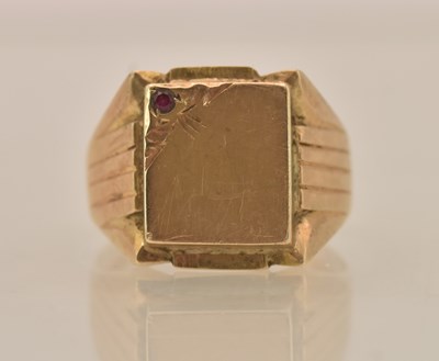 Lot 1262 - A yellow metal ruby set signet ring, set with...