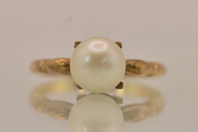 Lot 1314 - A yellow metal cultured pearl set solitaire...