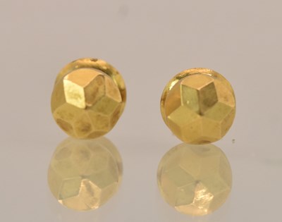 Lot 1448 - A pair of yellow metal ear studs, both testing...