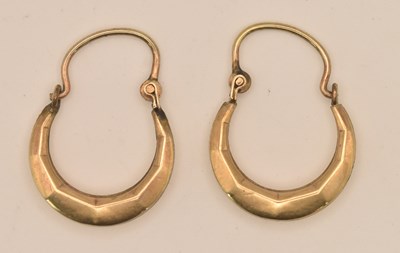 Lot 1462 - A pair of yellow metal hoop earrings, both...