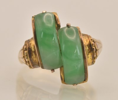 Lot 1293 - A Chinese yellow metal green carved jade set...
