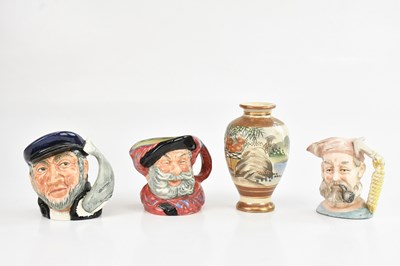 Lot 1095 - A small Japanese Satsuma twin handled vase,...